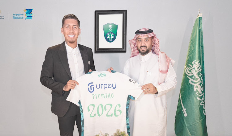 In a promotional picture released by Al-Ahli Saudi, former Liverpool star Roberto Firmino is presented as their new signing.