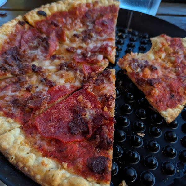Gluten free pizza, pepperoni and peppered bacon
