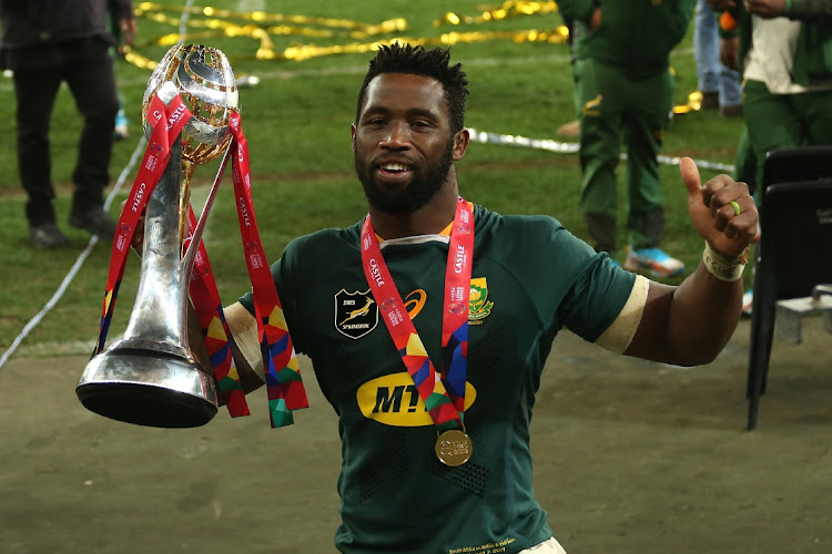 Springbok captain Siya Kolisi celebrates with the trophy after SA beat the British & Irish Lions for a series 2-1 win.