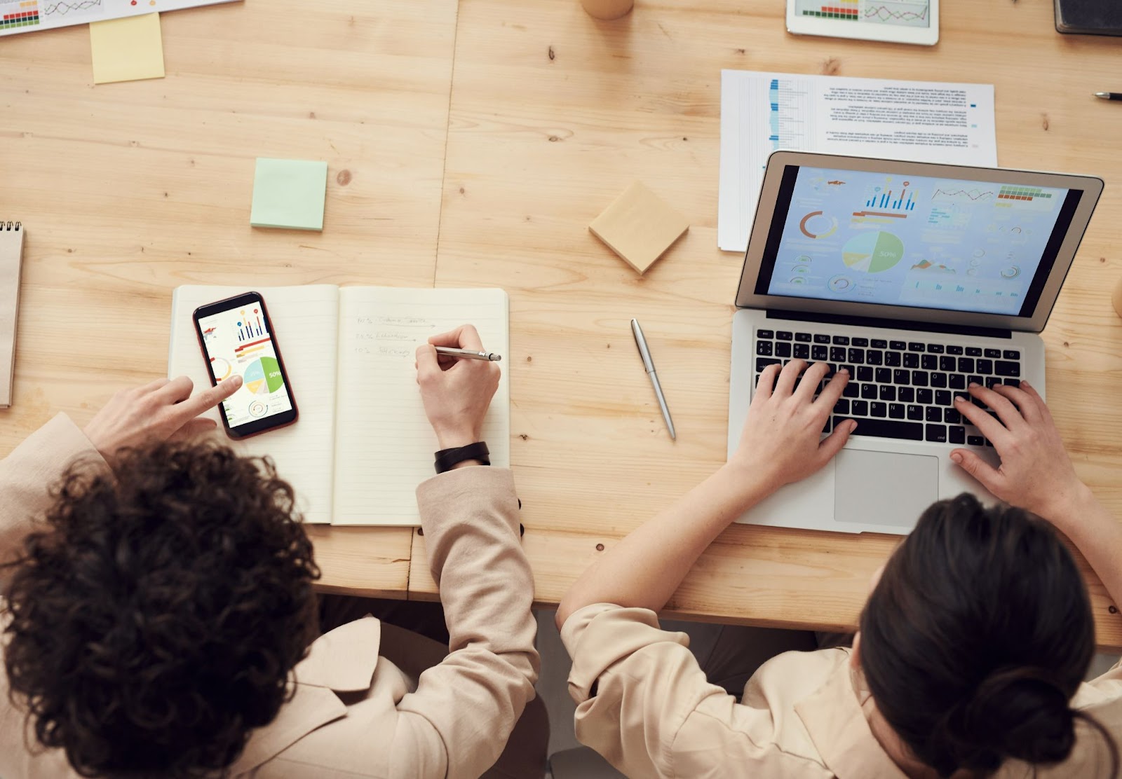 two people reviewing financial data