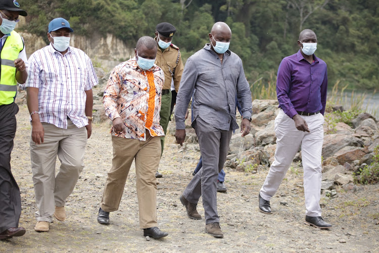 Government Spokesman Col (Rtd) Cyrus Oguna (right) with Principal Secretaries Joe Okudo (Sports), Jerome Ochieng (ICT and innovation), Joseph Irungu (Water and Sanitation) at Chemususu Dam in Eldama-Ravine on Tuesday, February 16.