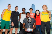 Olympic champion Usain Bolt (front C) poses with his team members (from L-R) Ryan Gregson of Australia, Matthew Wyatt of New Zealand, Christine Ohuruogu of England, Wataru Yazawa of Japan, Zhao Xinghai of China and Gen LaCaze of Australia during a press conference in Melbourne on February 3, 2017, ahead of the Nitro Athletics meet in Melbourne.