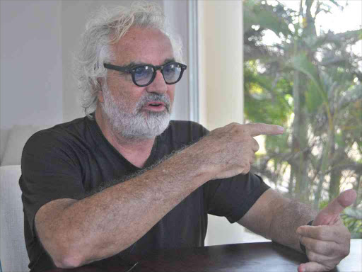 Italian billionaire Flavio Briatore addresses journalists at Billionaire Resort on March 12, 2018. /ALPHONCE GARI