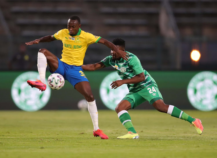 Peter Shalulile of Mamelodi Sundowns challenged by Thato Lingwati of Bloemfontein Celtic.