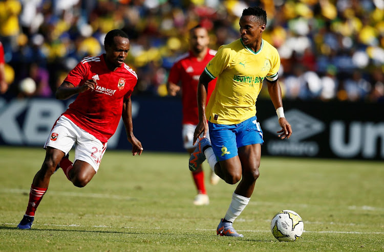Al Ahly star Percy Tau and Mamelodi Sundowns skipper Themba Zwane during the CAF Champions League match at Loftus Versfeld on March 11, 2023.