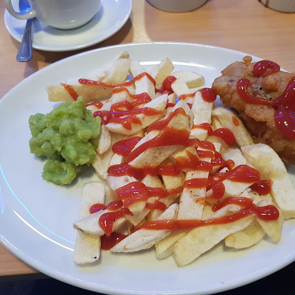 Gluten free battered sausage, chips and mushy peas!