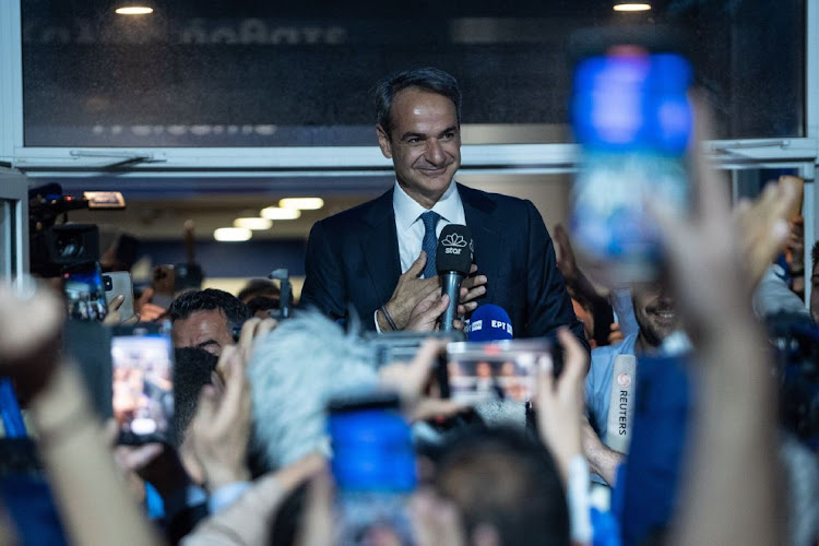 Kyriakos Mitsotakis, Greece’s prime minister and leader of New Democracy party, speaks to supporters outside the party’s headquarters following Greece’s general election, in Athens, Greece, on May 21 2023. Picture: BLOOMBERG/NICK PALEOLOGOS