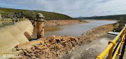 The Churchill Dam, pictured, and Impofu Dam, both on the Kromme River system west of Humansdorp, whose supply has long been the lifeblood of Nelson Mandela Bay. But today they are close to empty.