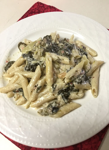 Utica Greens Penne:  A mixture of Utica Greens, heavy cream and Penne pasta.  The addition of cream to the Utica greens makes for a tasty sauce when the bread crumbs and parmesan mix with the cream. 