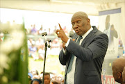 Deputy minister of Agriculture Bheki Cele paying his last respect to the late Mondli Cele at his funeral service held at the Folweni sports grounds. Picture credits: Phumlani Thabethe