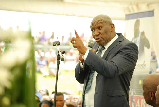 Deputy minister of Agriculture Bheki Cele paying his last respect to the late Mondli Cele at his funeral service held at the Folweni sports grounds. Picture credits: Phumlani Thabethe