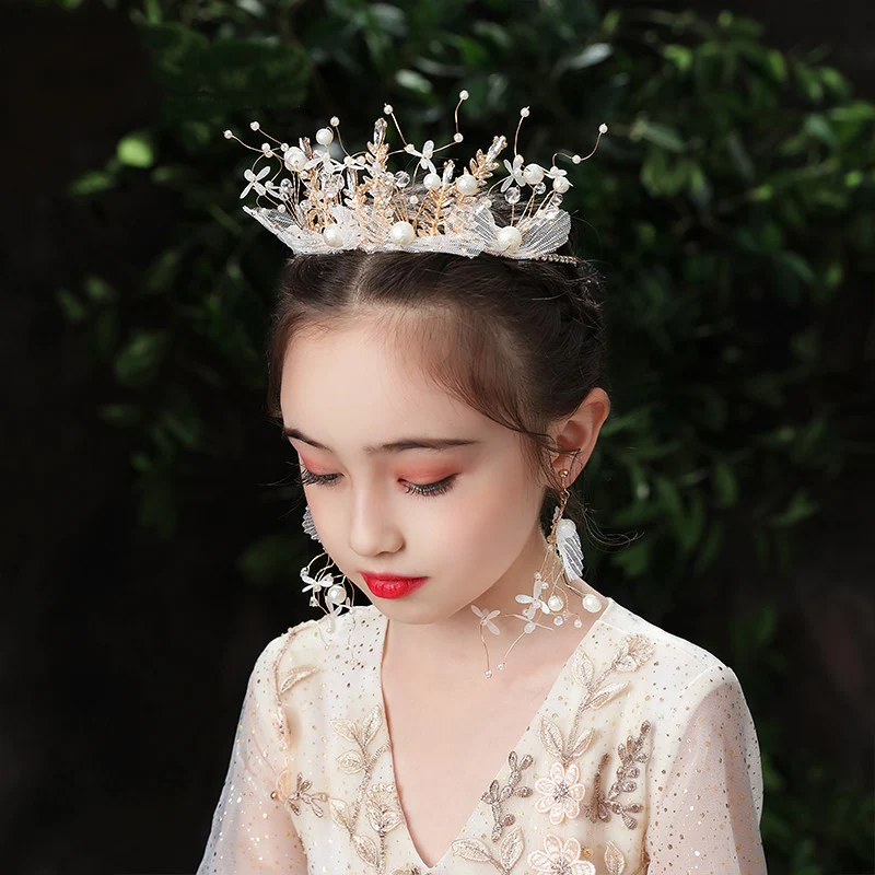 Cute children wearing a yarn crown, perfect for creative play, themed parties, and adorable photos. Fosters imagination 