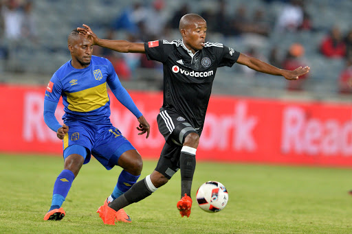 Thabo Matlaba of Orlando Pirates and Bongolethu Jayiya of Cape Town City during the Absa Premiership match between Orlando Pirates and Cape Town City at Orlando Stadium on September 20, 2016 in Soweto, South Africa.