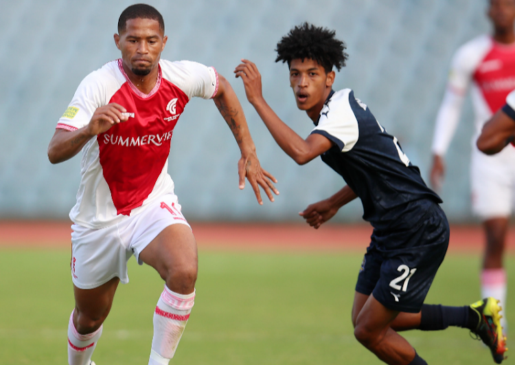 Colin Ryan of Cape Town Spurs in a tussle for the ball with Marcel Jonosky of La Masia during their Motsepe Foundation Championship at the Dobsonville Stadium, Soweto on May 7 2023.