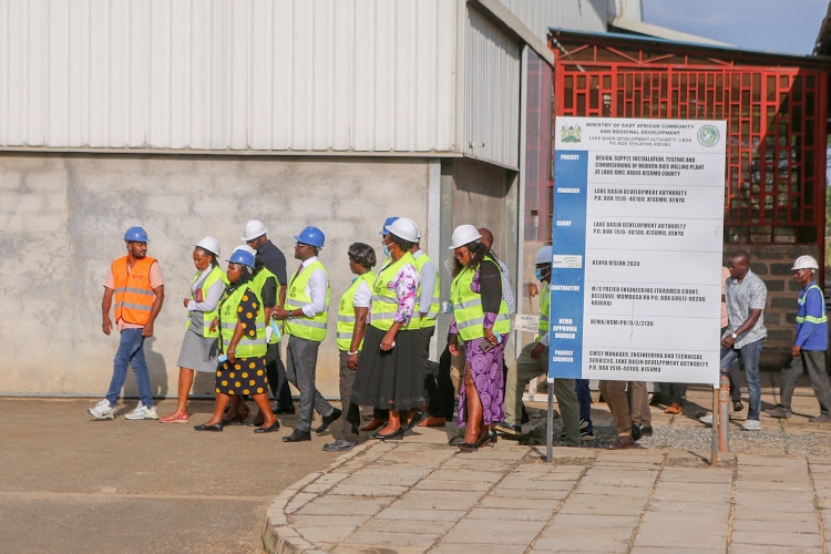 Cabinet Secretary for EAC and Regional Development Peninah Malonza during inspection at the LBDA Rice mill in Kibos area in Kisumu