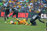 Thabo Matlaba ,Thamsanqa Sangweni and Hendrick Ekstein during the Carling Black Label Champion Cup match between Orlando Pirates and Kaizer Chiefs at FNB Stadium on July 29, 2017 in Johannesburg, South Africa. 