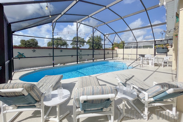 Sun-drenched south-facing pool deck at this Indian Ridge Oaks vacation villa