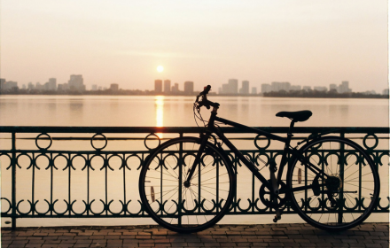 Bicycles parked by the lake small promo image