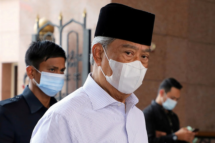 Malaysia's Prime Minister Muhyiddin Yassin wearing a protective mask arrives at a mosque for prayers, amid the coronavirus disease (Covid-19) outbreak in Putrajaya, Malaysia August 28, 2020.