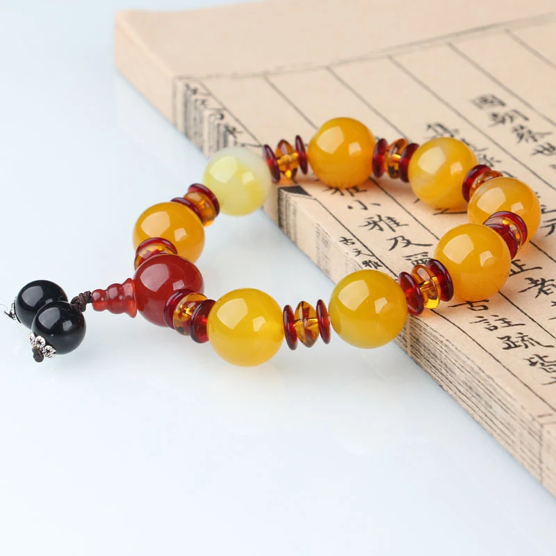 Men's Agate Hand String Bracelet with Buddha Head, a stylish and protective natural gemstone accessory.