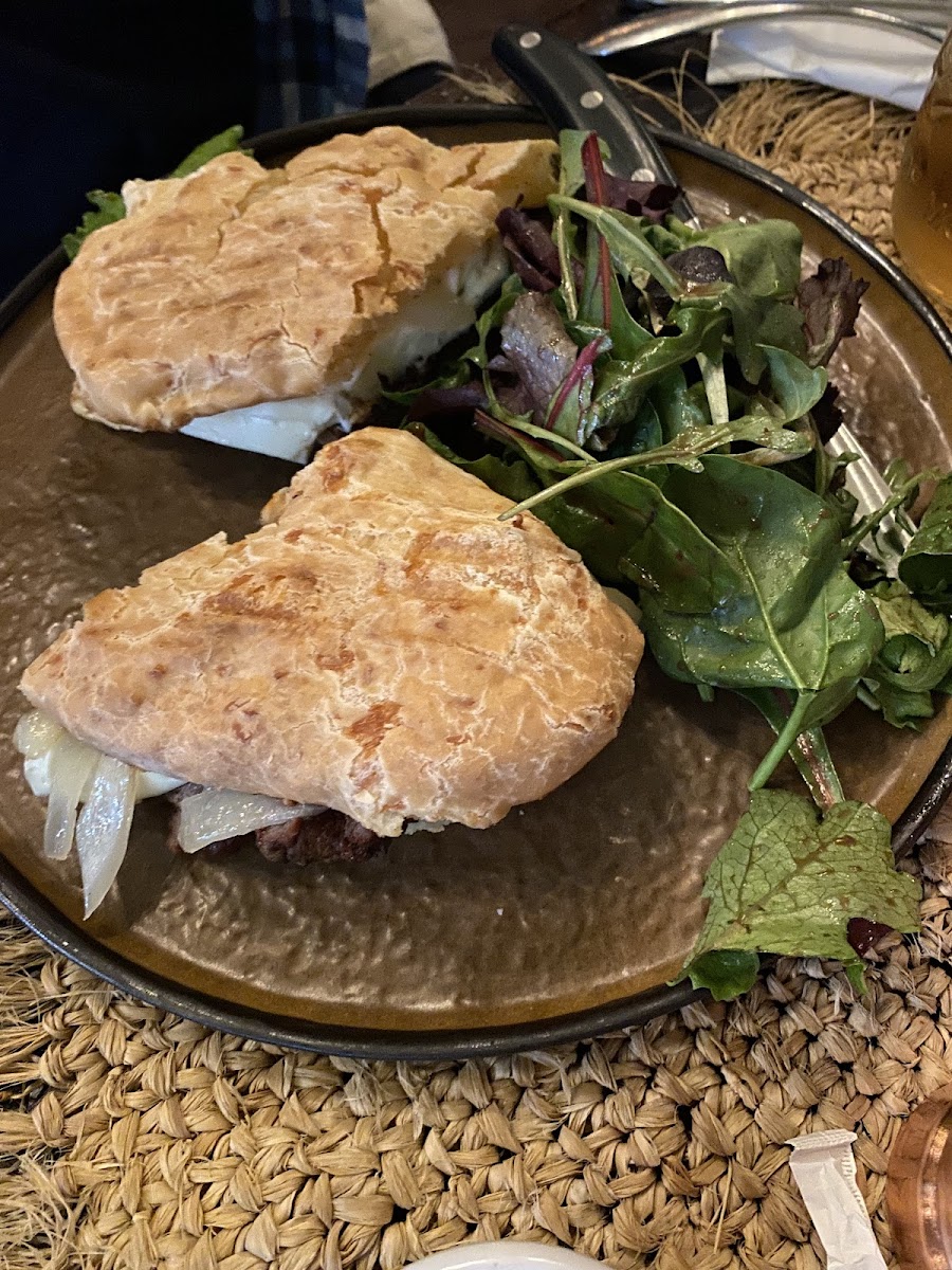 Steak and cheese panini on cheese bread