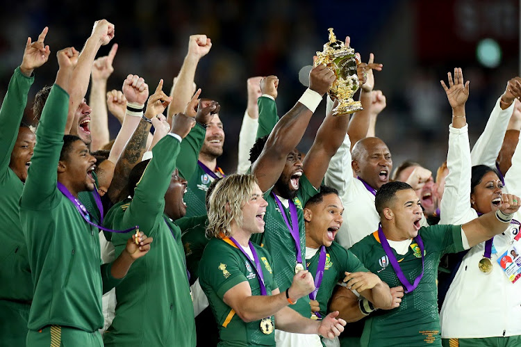 The Springboks celebrate as Siya Kolisi holds the Web Ellis trophy after their Rugby World Cup (RWC) victory against England at International Stadium Yokohama, Japan, on November 2 2019.