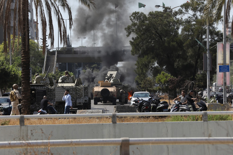 Fires broke out during fierce gun battles during a protest in Beirut, Lebanon, October 14 2021. Picture: MARWAN TAHTAH/GETTY IMAGES