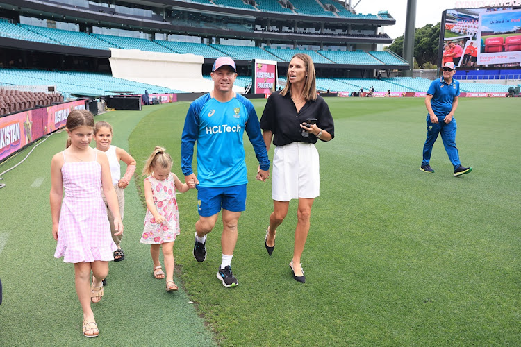 David Warner of Australia leaves a press conference to announce his retirement with his daughters and wife Candice ahead of the third Test between Australia and Pakistan at the Sydney Cricket Ground on New Year's Day.
