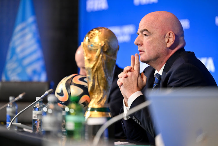 Fifa president Gianni Infantino with the Fifa World Cup during a virtual council meeting in Zurich. File photo