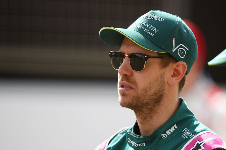 Sebastian Vettel looks on from the grid during day one of F1 testing at Bahrain International Circuit on March 12 2021.