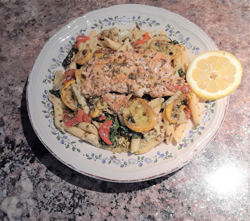 Lemon Basil Pesto Chicken Breast over a bed of Penne Pasta, Artichoke Hearts, Posted Red Bell Peppers, Yellow Squash, Kale Greens. 