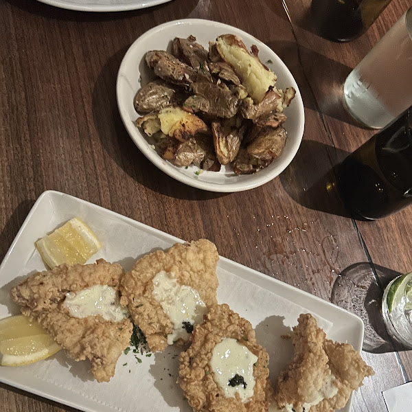 Gluten free buttermilk fried chicken with caviar and fried potatoes