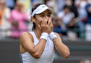 Emma Raducanu of Great Britain celebrates match point in her women's singles third round match against Sorana Cirstea of Romania on day six of The Championships - Wimbledon 2021 at the All England Lawn Tennis and Croquet Club on July 03, 2021.