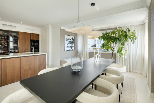 Modern dining room with open kitchen in this luxury villa for sale in Marbella ($3,119,560 - 231 m²)