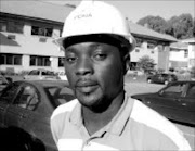 CONSTRUCTIVE: Alain Kivuvu, a civil engineering technician. © Unknown.