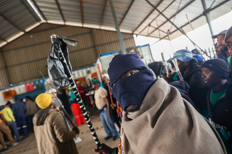 Mineworkers showing solidarity with colleagues staging a sit-in at Gold One mine in Springs. Protesters demanded the reinstatement of miners fired for being part of an illegal strike in October.