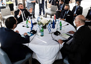 Cypriot Foreign Minister Nikos Christodoulides, Israeli Foreign Minister Gabi Ashkenazi, Greece's Foreign Minister Nikos Dendias and Anwar Gargash, diplomatic adviser of UAE's President, talk during a meeting in Paphos, Cyprus April 16, 2021. 