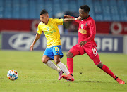 Mamelodi Sundowns midfielder Gaston Sirino challenged by Menzi Chili of Summerfield Dynamos during their Nedbank Cup quarterfinals at Loftus Versfeld Stadium.