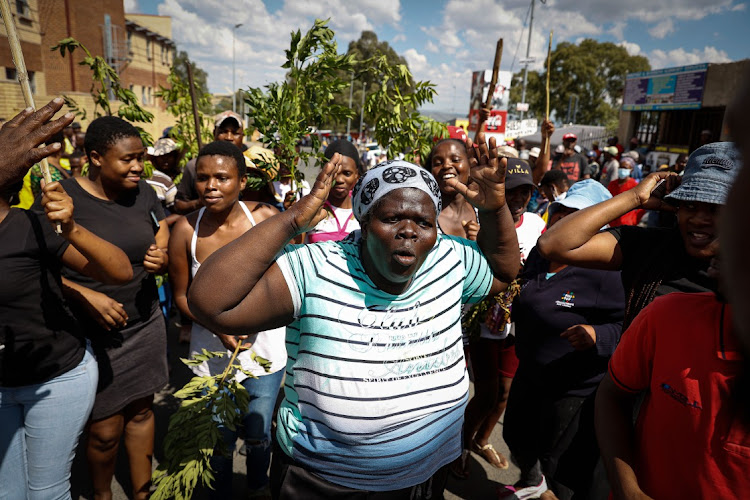 Josephine Mello from Diepsloot, north of Johannesburg, protests over the high crime rate in the informal settlement after a man was killed during a robbery at the weekend.