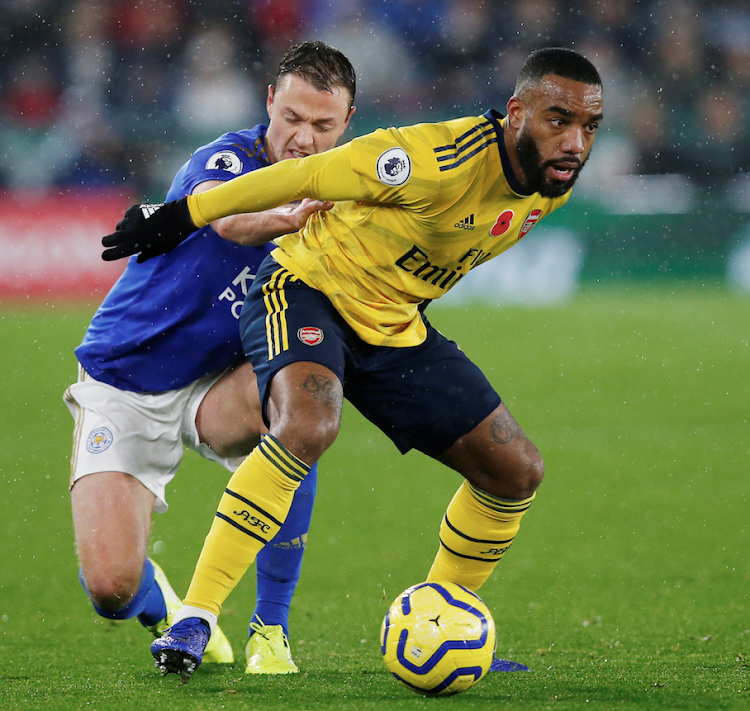 Leicester City's Jonny Evans in action with Arsenal's Alexandre Lacazette