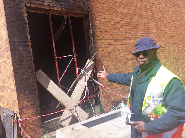Tiro Mokgosi, acting general manager of the Lenasia service delivery centre, which leads the repair work at the burnt Eldorado Park substation, indicates toward the feeder board that was burnt on Good Friday.