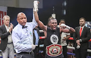 Sikho Nqothole excited after being declared a winner in the WBO global junior bantamweight title clash against Filipino Denmark Quibido in Sandton. 