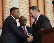 KZN MEC for Education Mthandeni  Dlungwane  shakes hands with Chris Lyman the Headmaster  of Maritzburg College after addressing matrices before their first final exam Picture : Jackie Clausen