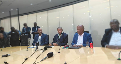 From left: Telkom group CEO Serame Taukobong, Telkom group chairman Geoffrey Qhena and communications minister Mondli Gungubele.