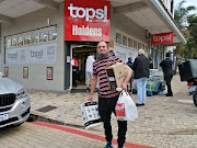 David Layton gives off a big smile outside Holden Tops liquor store on Durban's iconic Florida Road. 