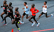 NOT FAIR: In Nike Vaporfly shoes, Lelisa Desisa,  Eliud Kipchoge and  Zersenay Tadese track pacemakers during an attempt to break the two-hour marathon barrier. 