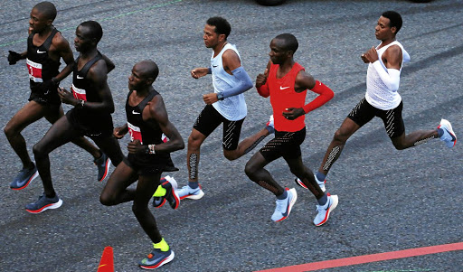 NOT FAIR: In Nike Vaporfly shoes, Lelisa Desisa, Eliud Kipchoge and Zersenay Tadese track pacemakers during an attempt to break the two-hour marathon barrier.