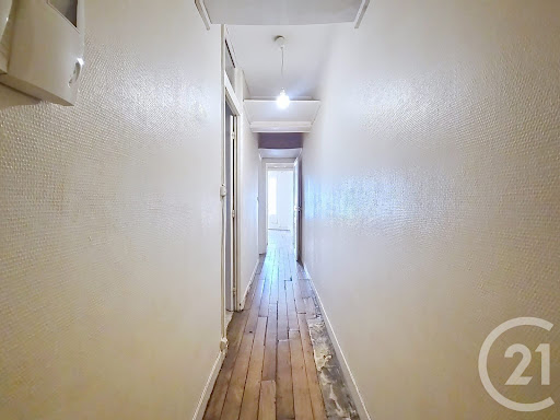 Narrow hallway with old wooden floor in this luxury apartment / penthouse for sale in Paris 10ème ($841,970 - 71 m²)