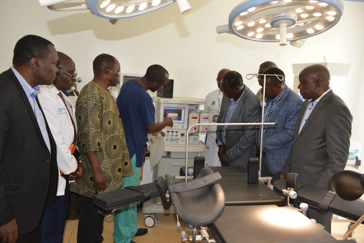 Governor Wilbur Ottichilo and his deputy Patrick Saisi inspecting the new dental machines at Emuhaya Hospital in Luanda subcounty.