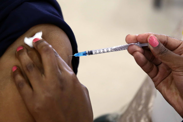 A health worker receives her Covid-19 vaccine. File photo.